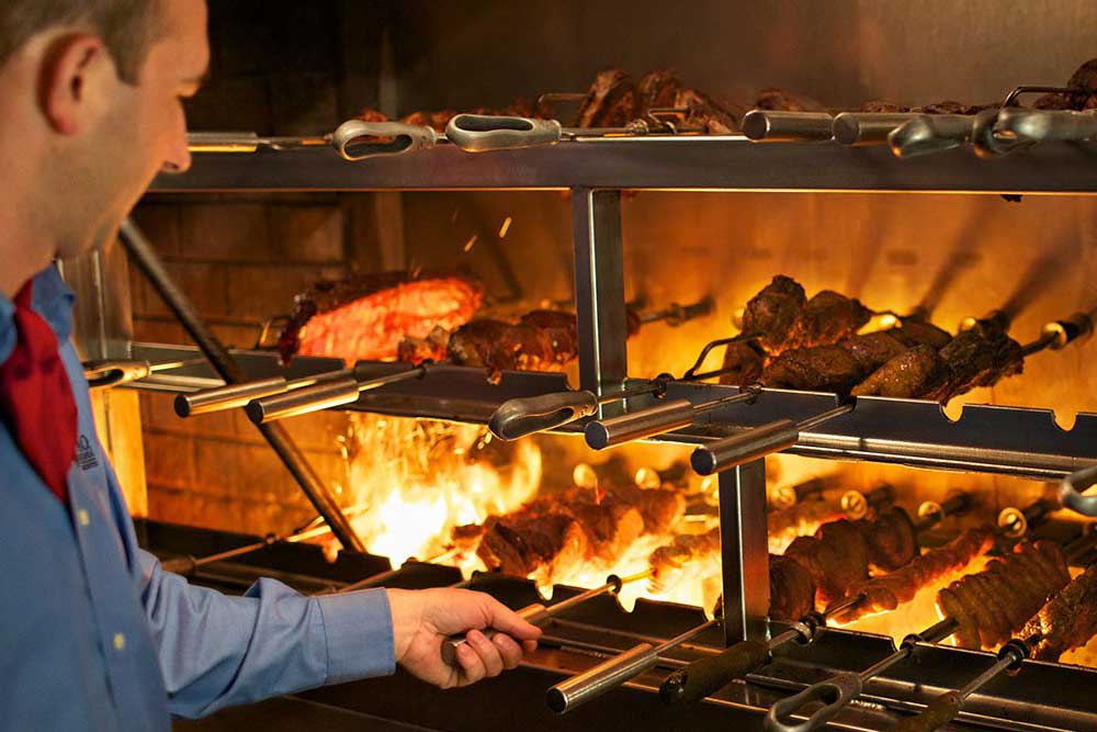 steak being grilled at a steakhouse in our Best Steakhouses in Chicago list