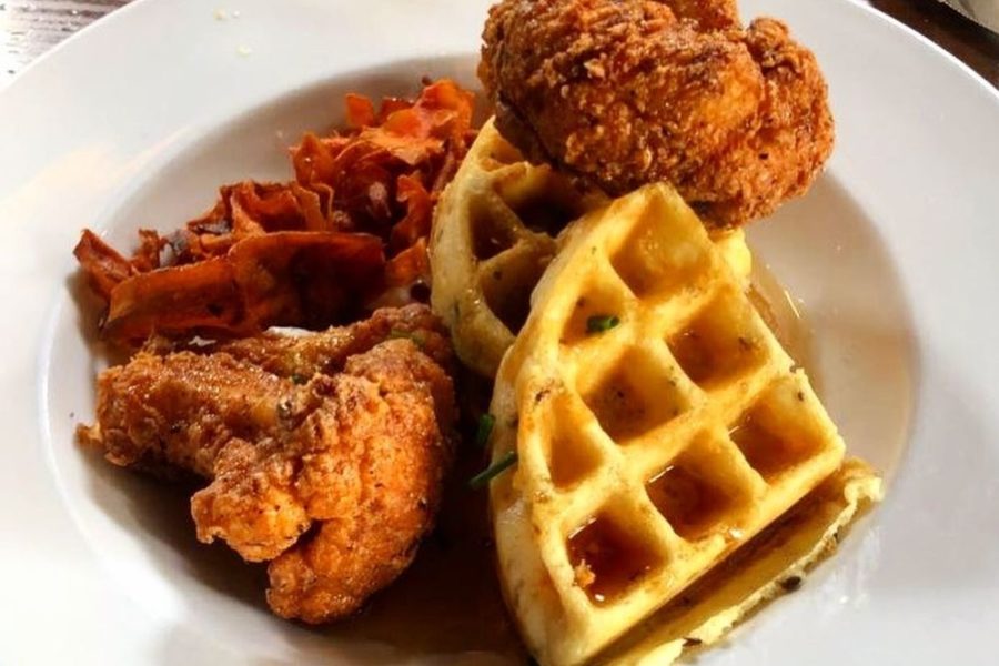 CHICKEN & WAFFLES Waffle with chicken-fried cauliflower** with bourbon maple syrup, chive creme fraiche, carrot bacon