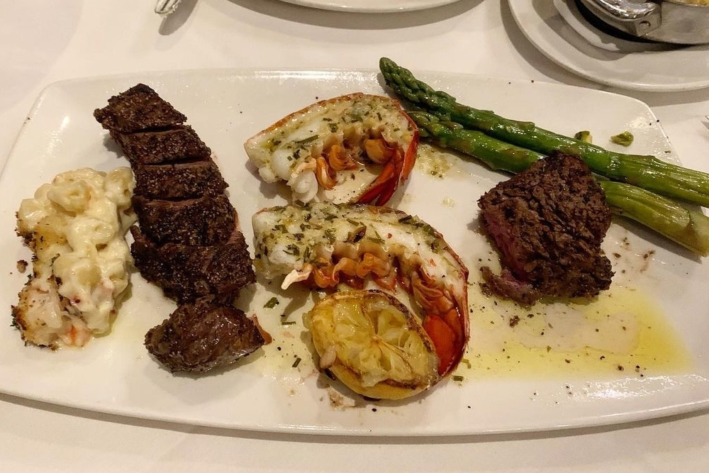 steak served with shrimp, mac and cheese, and asparagus from Del Frisco’s Double Edge Steakhouse in Denver