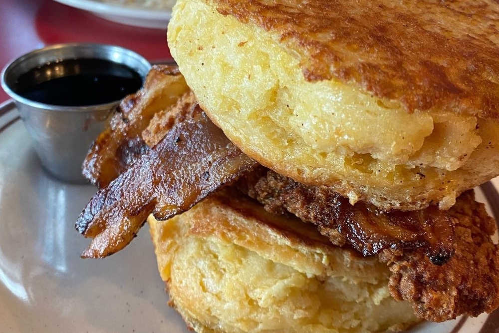 a bacon biscuit from the Denver Biscuit Company, featured on our Breakfast Restaurants in Denver list