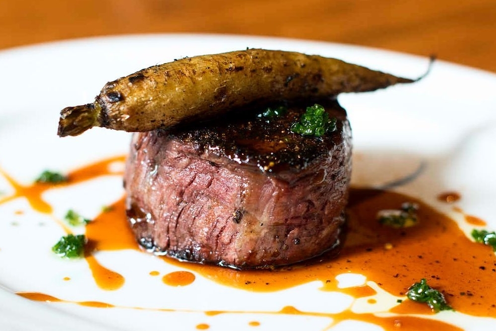 a tasty steak dish from guard and grace, on our list of best steakhouses in Denver