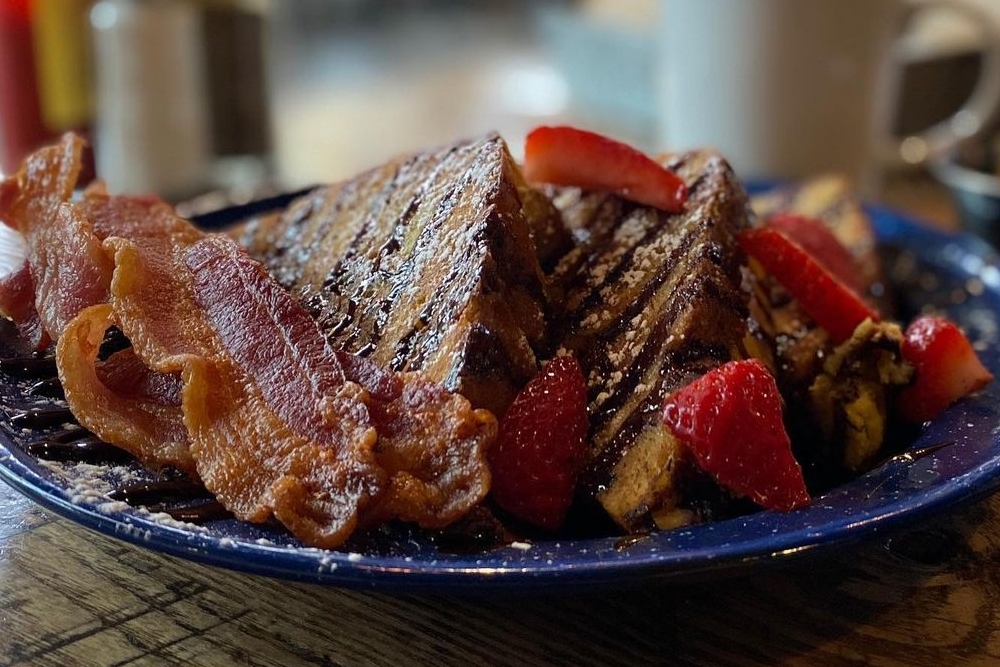 a tasty breakfast of french toast, caramelised bacon and fruit from Olive and Finch