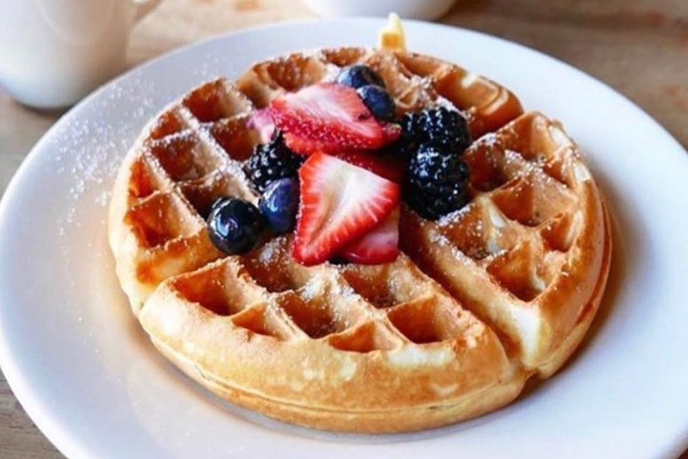 waffle and fruit dish from the Cookery at Myrtle Hill, on our best brunch in Denver list