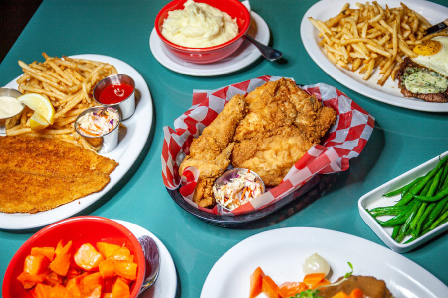 fried chicken, fried fish, side of fries and mash potatoes from jones in philly
