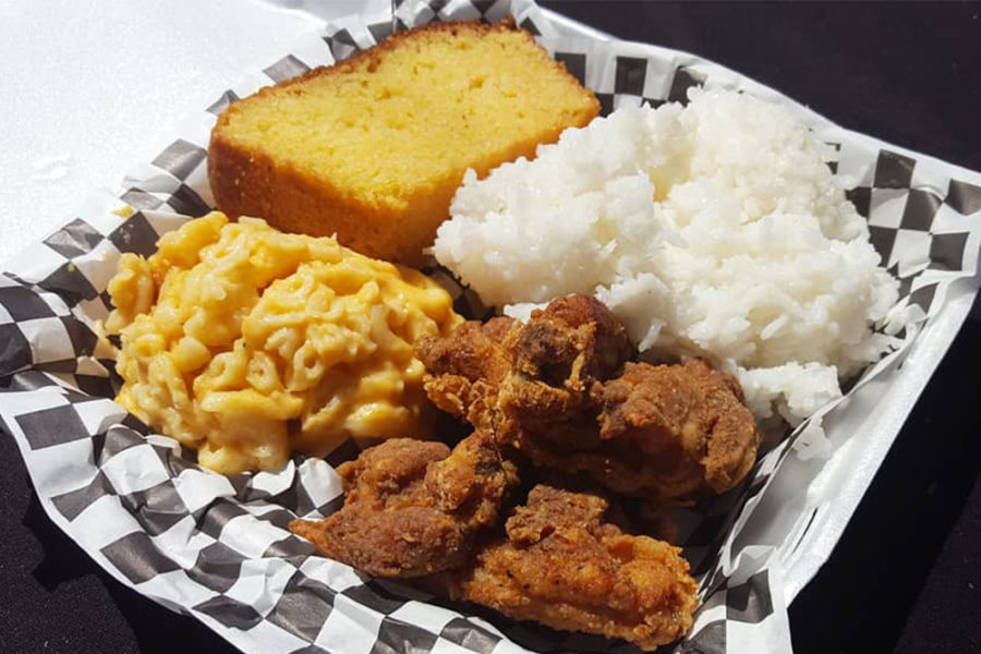 fried chicken, mac and cheese, cornbread, and white rice from southern grinds in kahuku, hawaii