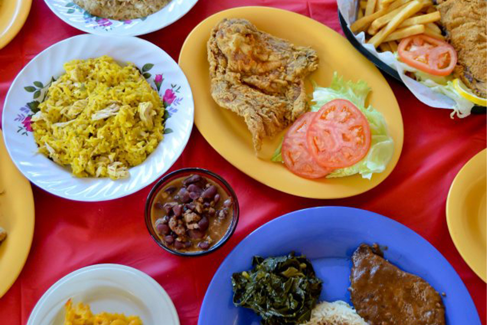 fried chicken, rice, beans, and other dishes from mama's soul food restaurant in tampa
