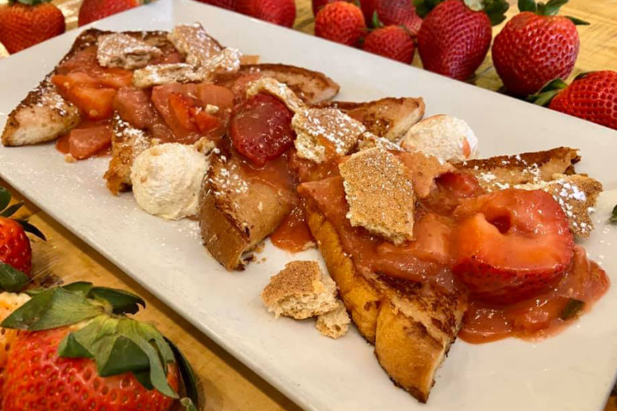 french toast topped with fresh strawberries from batter and berries in chicago