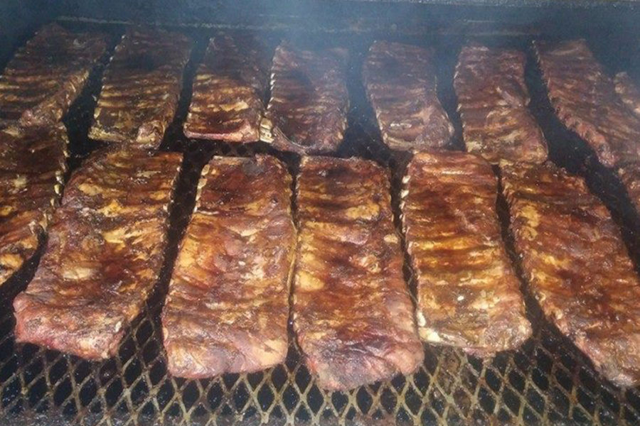 bbq meat on the grill at kojak's house of ribs in tampa
