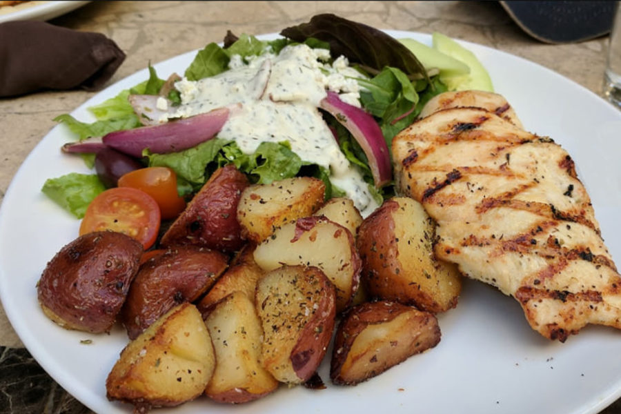 grilled chicken, potato wedges, and side salad from zizikis in dallas
