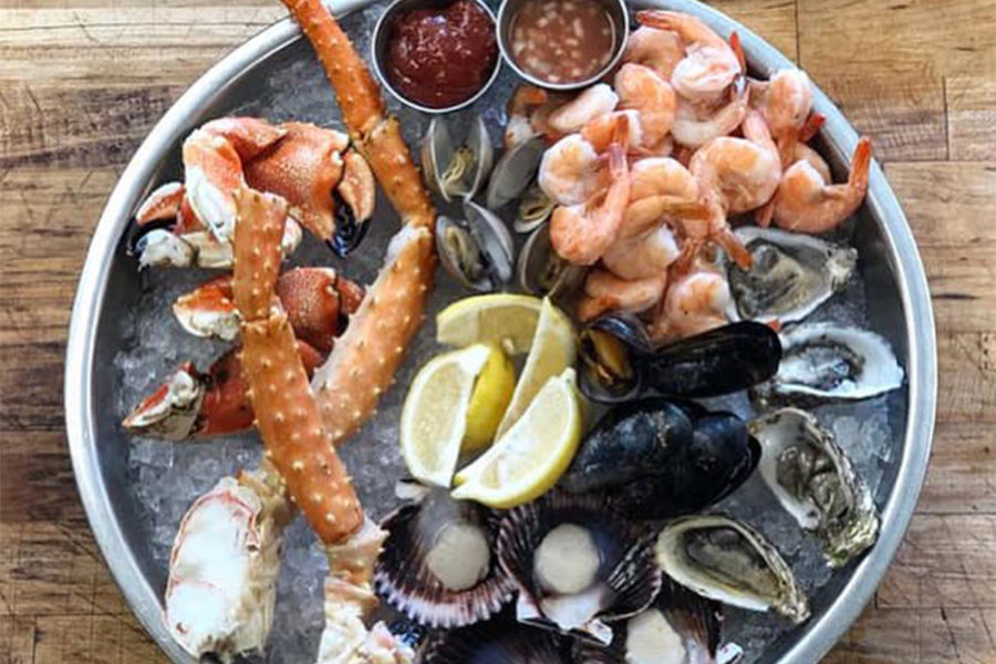 fresh seafood platter from bali hai in san diego including shrimp, clams, oysters, and crab