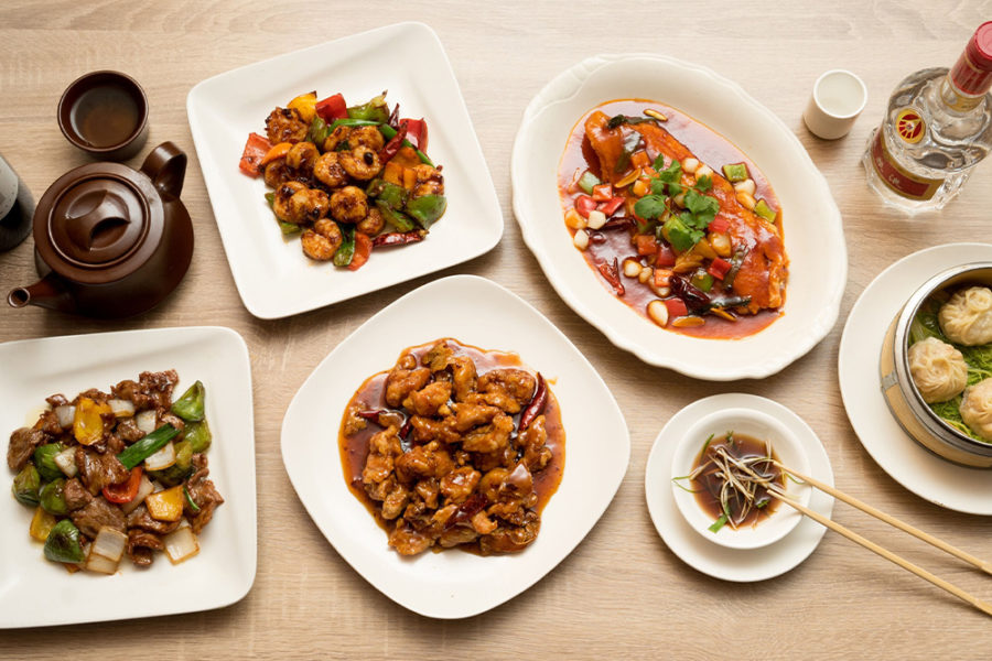 an assortment of chicken dishes from moon palace restaurant in chicago