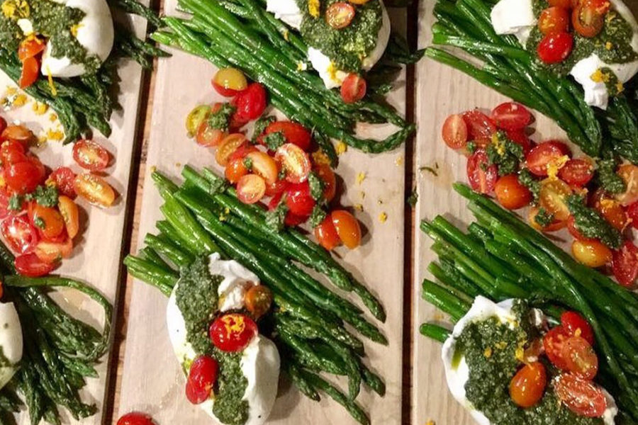 greenbeans and burrata topped with tomatoes and pesto from popcultivate in los angeles