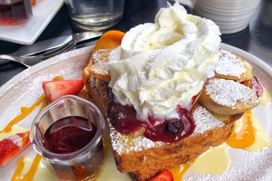french toast topped with fresh fruit and whip cream from cafe la maude in philly