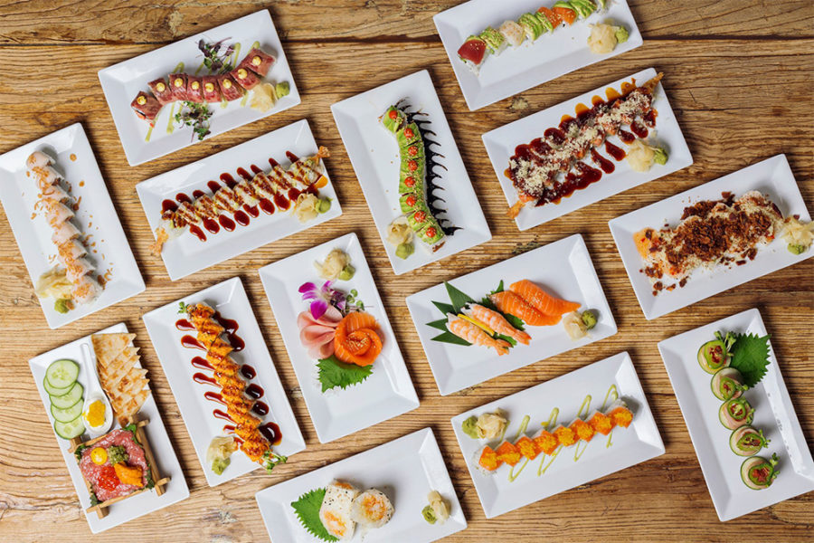 tablescape of multiple sushi dishes from Sunda new asian in Chicago 