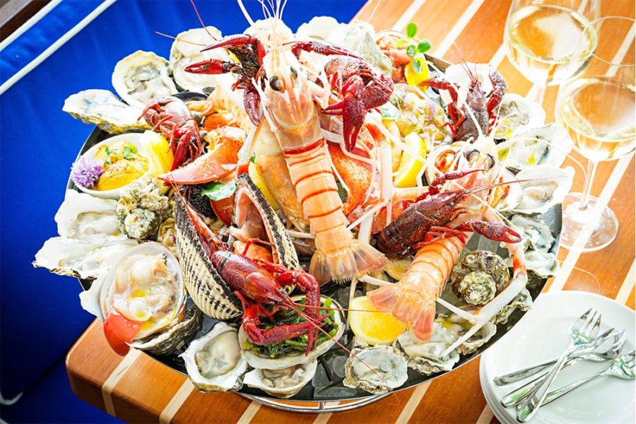 seafood platter with fresh oysters, lobster, crawfish, crab, and more from fiola mare in dc