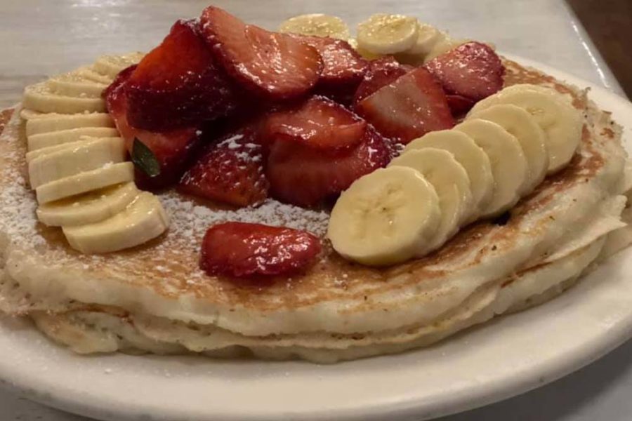 pancakes topped with fresh strawberries and banana slices from brian's 24 in san diego