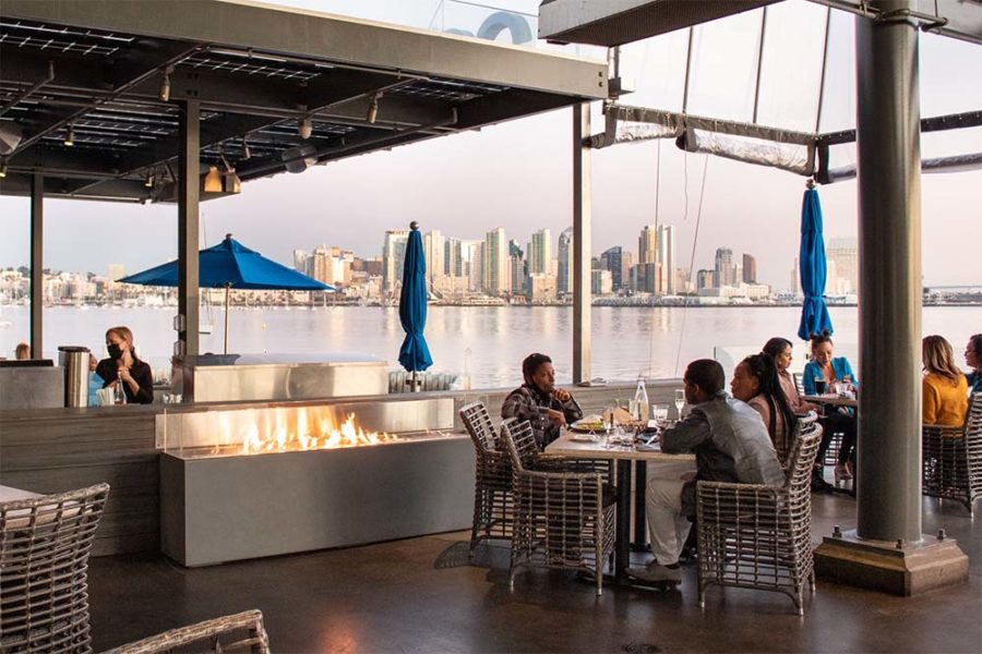 the outdoor patio at coasterra overlooking the san diego waterfront and skyline