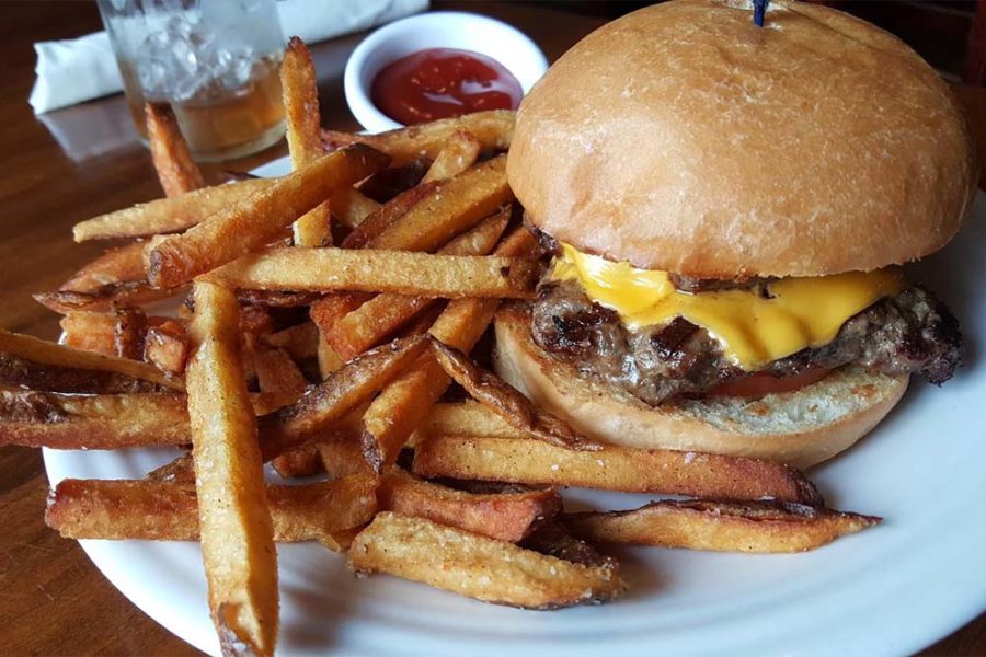 cheeseburger and fries from tusk and trotter american brasserie in bentonville, arkansas