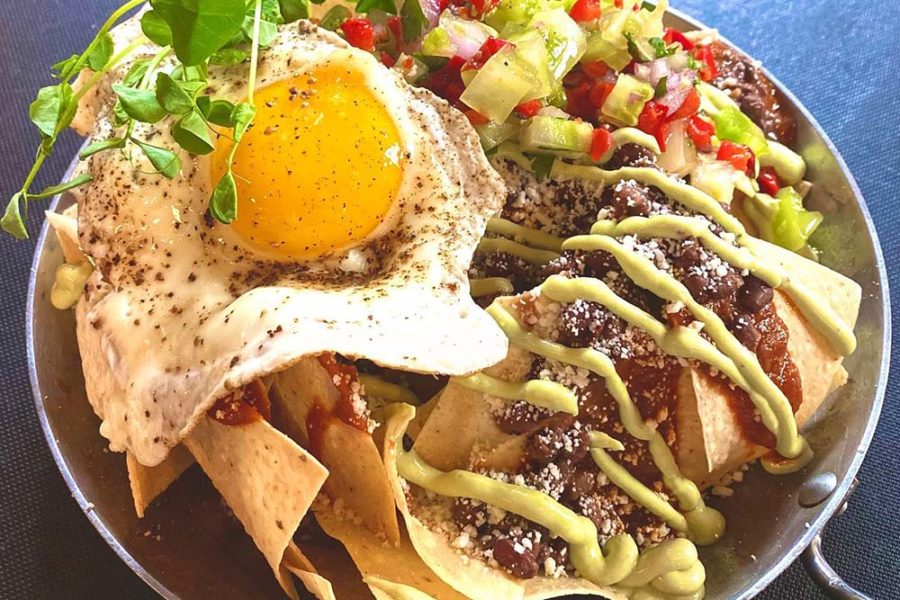 chips topped with egg, guac, and pico de gallo from soby's in greenville, south carolina