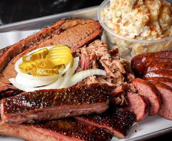 bbq ribs, sausage, and mac and cheese from la traila berbecue in miami beach