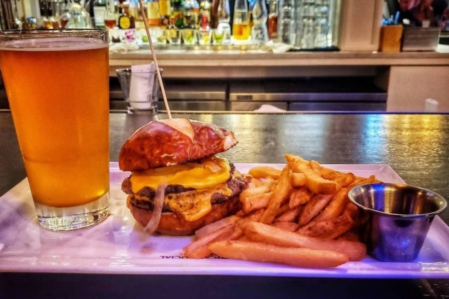 beer, cheeseburger, and a side of fries from american social in tampa