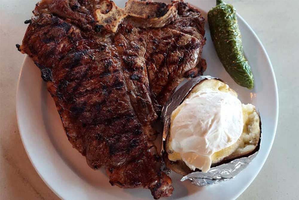 steaks and baked potato from Columbine Steak House and Lounge in Denver