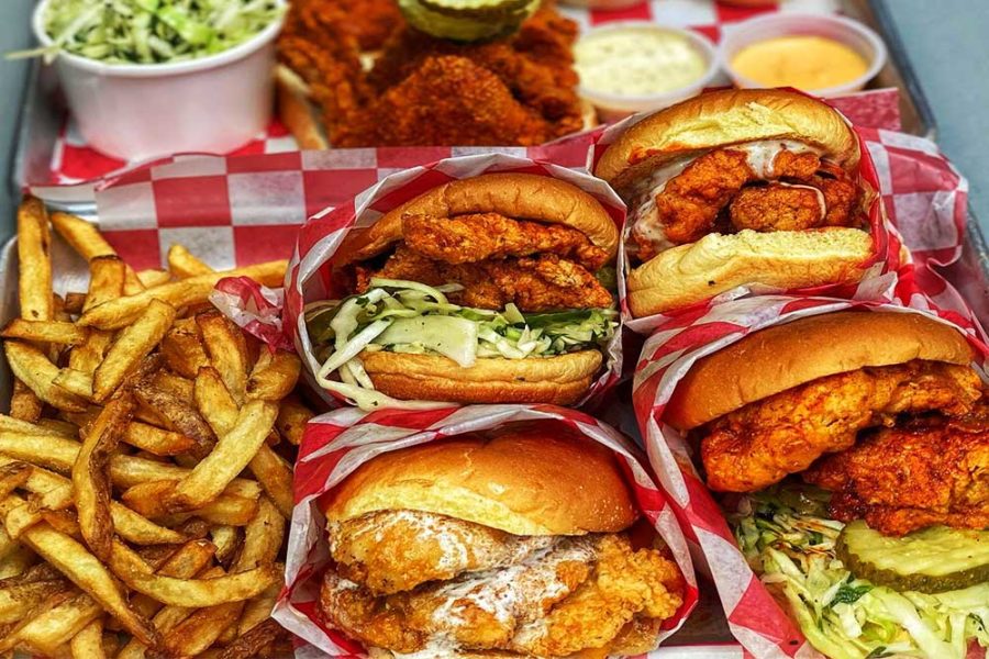 a variety of chicken sandwiches and a side of fries from roaming rooster in DC