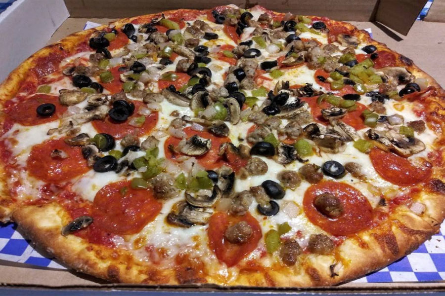 pizza with pepperoni, green peppers, mushroom, olives, and ground meat from Chicago Bros Pizzeria in san diego