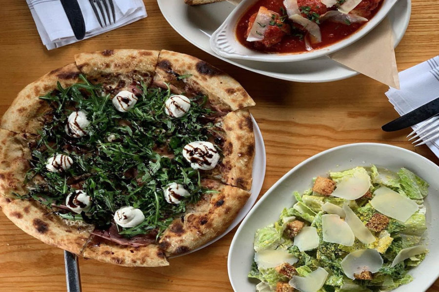 Pizza, caesar salad, and meatballs from Pie Tap Pizza Workshop in dallas