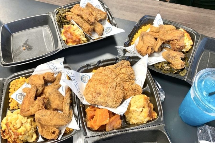 several friends chicken plates with sides from Sundays eatery in Miami, fl 