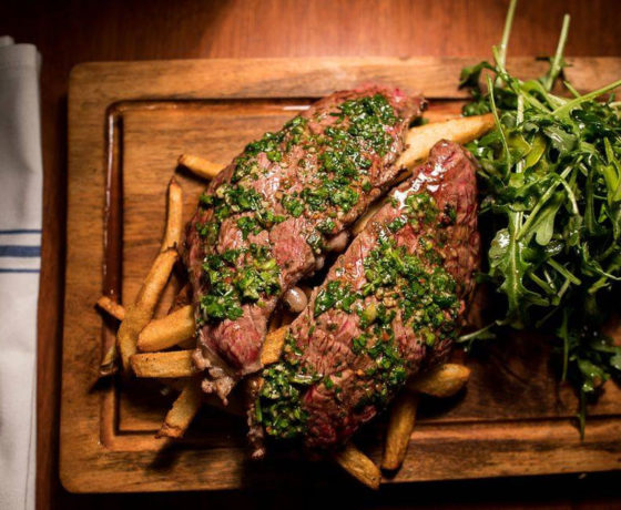 steak, fries, and greens from boca restobar and grill
