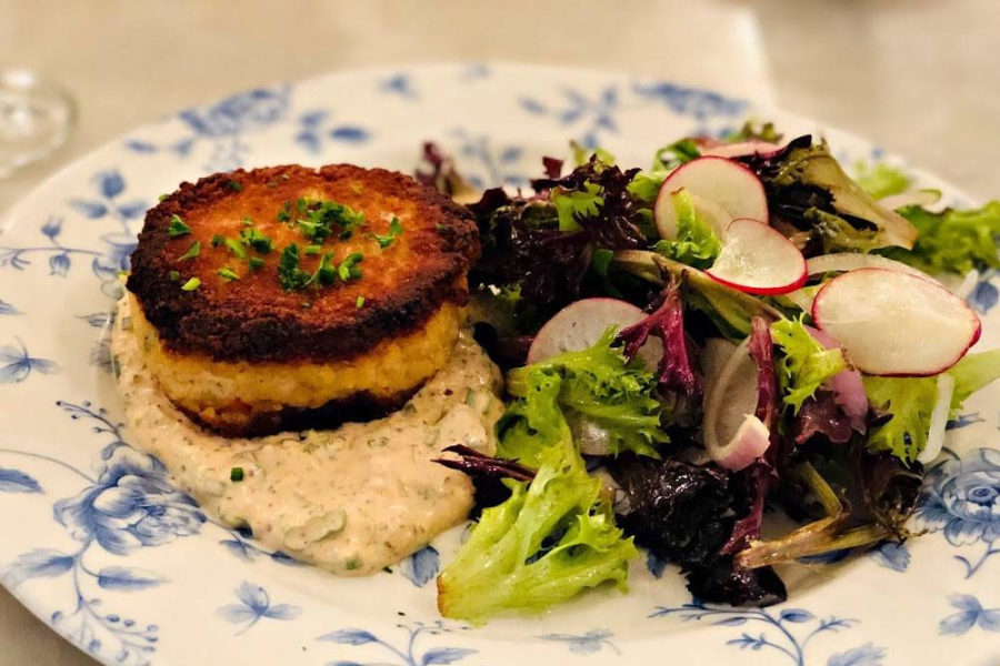 crab cake with side salad from blue door farm stand in chicago