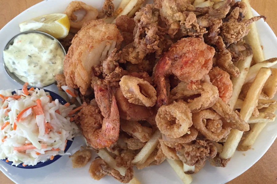 seafood dish with shrimp, calarmari, and fries from legal sea foods in boston