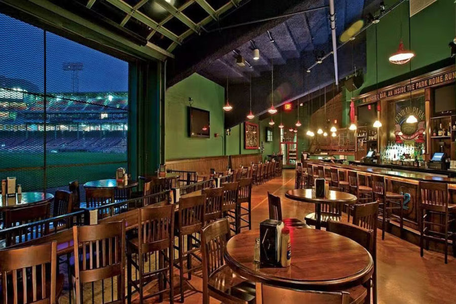 indoor dining and bar at bleacher bar with view of stadium in boston