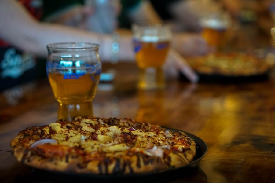 pineapple and bacon pizza with beer from tailgate brewery in nashville