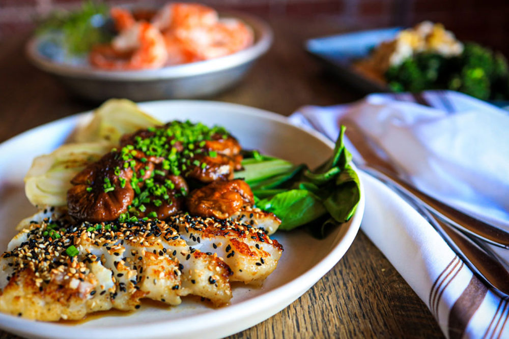 salmon bowl with greens and chicken from mercantile dining and provision in denver