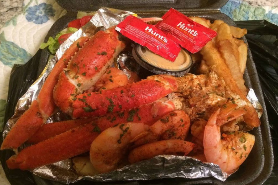 lobster, shrimp, and fries from nana's seafood and soul uptown in charleston