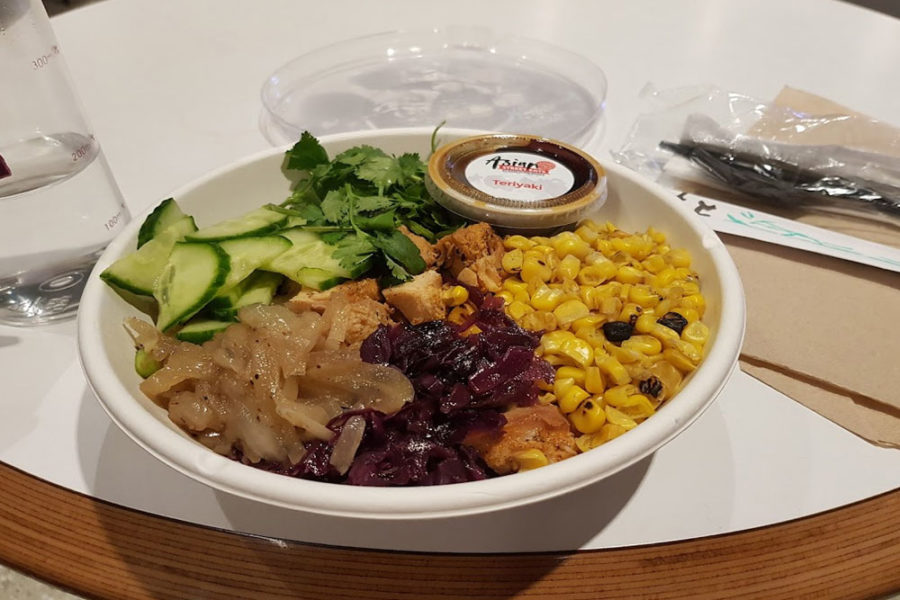 deconstructed poke bowl with beetroot, onions, cucumbers, arugula, corn, and teriyaki sauce from planet hollywood at LAX