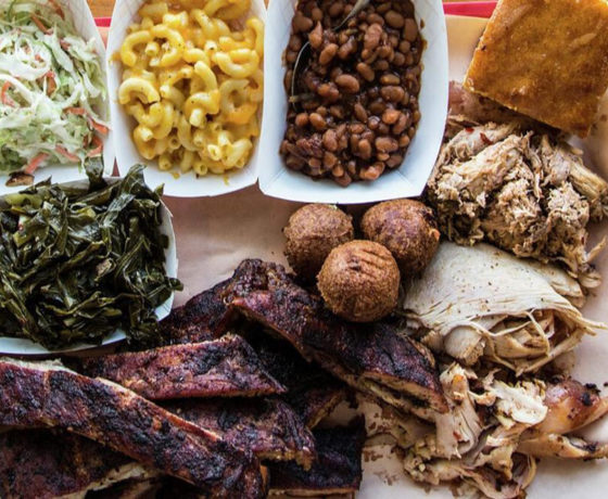 baby back ribs, pulled chicken and sides of collard greens, coleslaw, mac and cheese, baked beans, and cornbread from rodney scott's BBQ in charleston