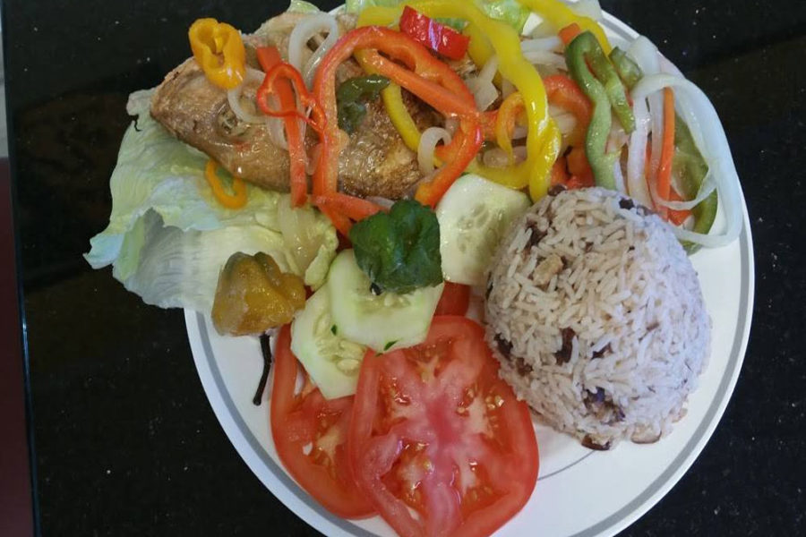 escovitch fish with side of rice and salad from taste of the islands in charleston