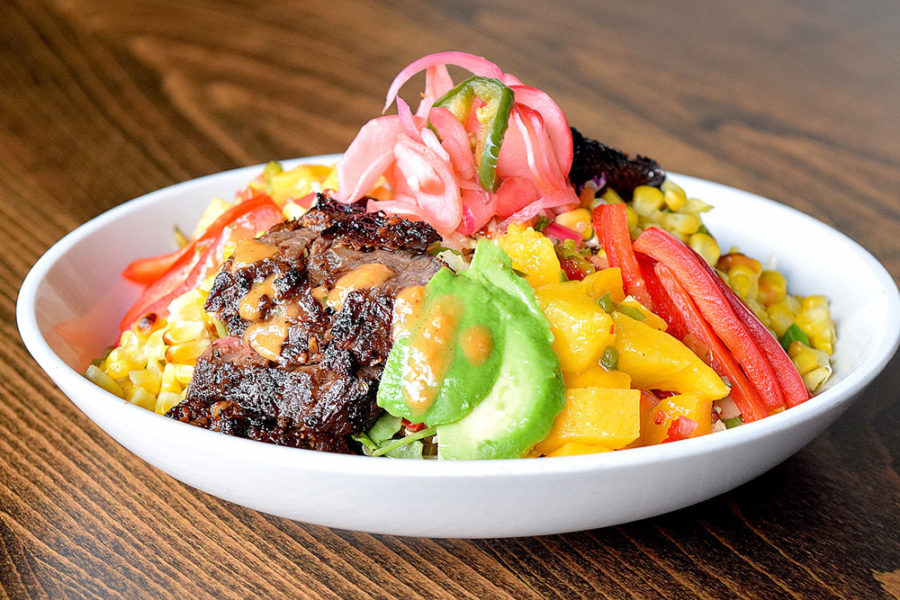 salad bowl with corn, ribs, avocado, squash, and other toppings