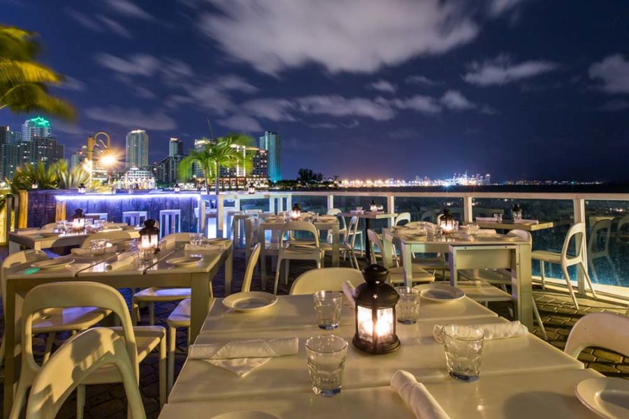 outdoor dining area overlooking the miami skyline at crazy about you