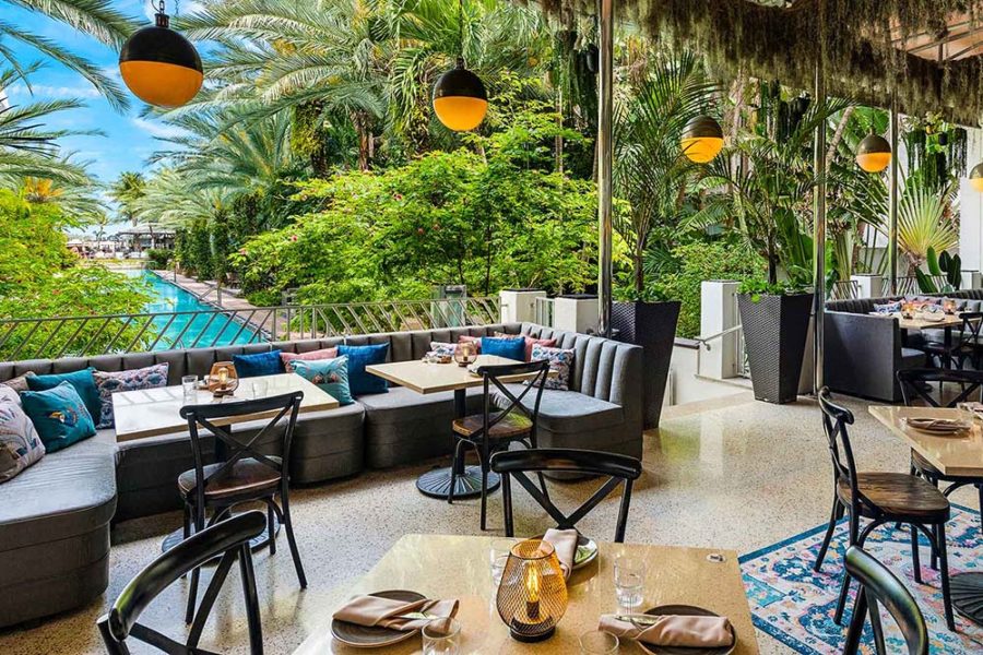 outdoor dining area overlooking a pool at mavera 939
