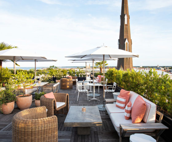 outdoor dining area at citrus club with a view of charleston's waterfront