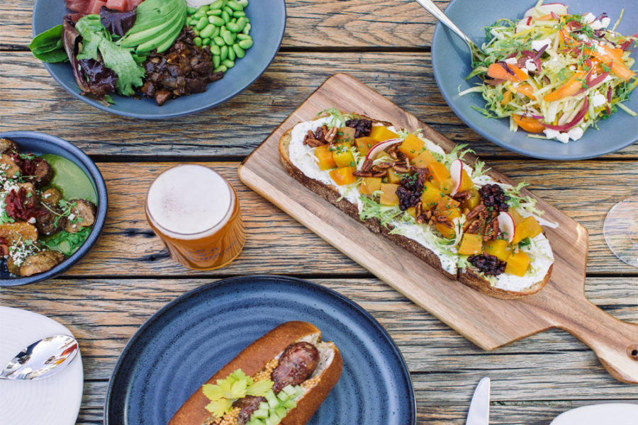 salads, sandwiches, and a glass of beer from floor 13 rooftop bar in phoenix