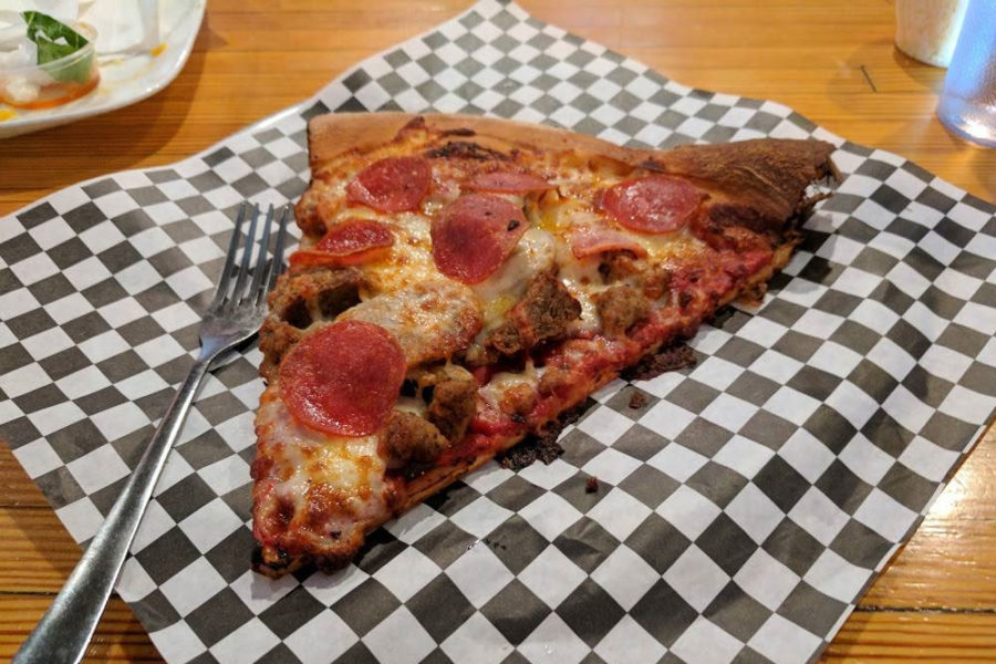 slice of pepperoni and sausage pizza from AJ’s NY Pizzeria in topeka, KS