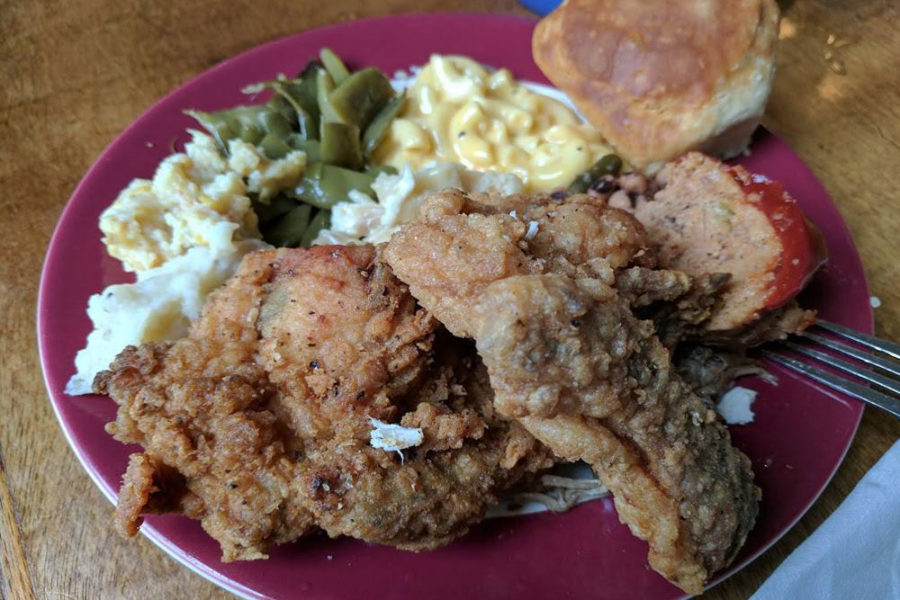 fried chicken, mashed potatoes, collards, mac and cheese, and cornbread from monell's dining and catering in nashville