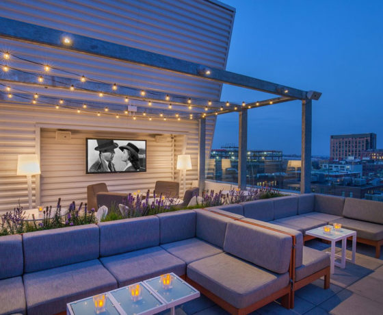 outdoor lounge area at the rooftop at revere in boston