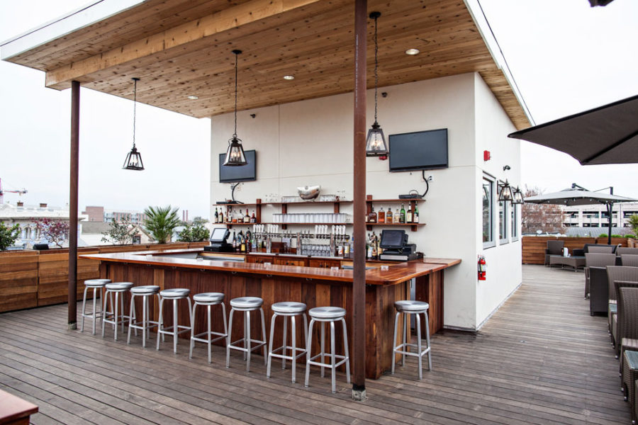 outdoor bar at the stars rooftop and grill room in charleston