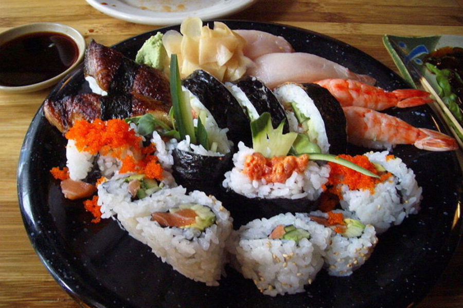 a variety of sushi rolls and sashimi from sushi den in denver